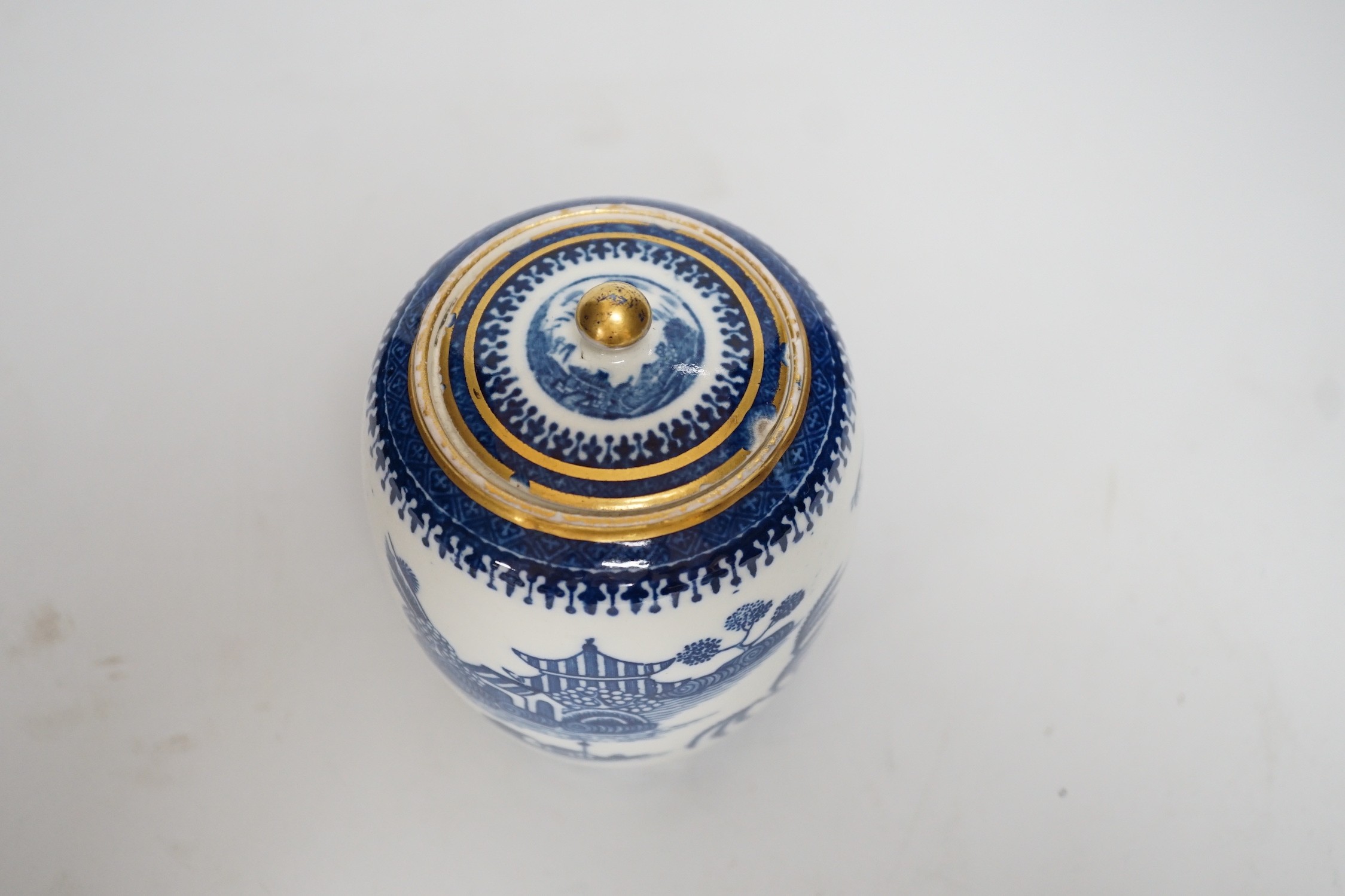 An 18th century Caughley tea canister and cover printed with Willow Nankin pattern,12.5cms high